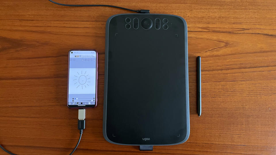 Ugee M908 review; a drawing tablet connected to a smartphone