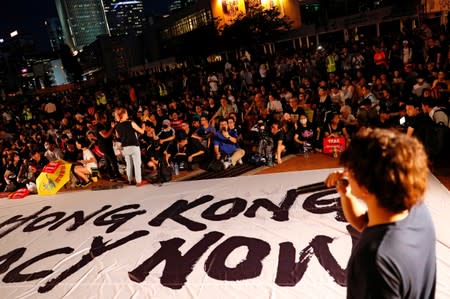 Demonstrators attend a rally ahead of the G20 summit, urging the international community to back their demands for the government to withdraw a the extradition bill in Hong Kong