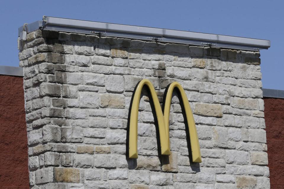 The McDonald's golden arches logo is pictured on a brick wall at one of the fast food chain's restaurants.