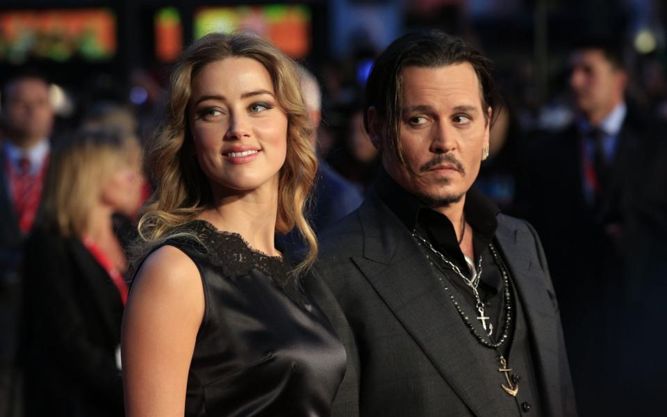 Johnny Depp with wife Amber Heard in 2015 - Jonathan Brady/PA