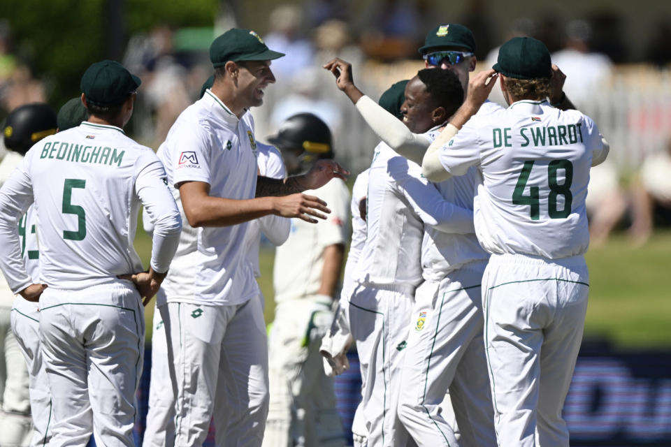 South Africa's Tshepo Moreki, third right, celebrates with team mates after taking the wicket of New Zealand's Devon Conway during day 1 of their cricket test match in Mount Maunganui, New Zealand, Sunday Feb 4, 2024. (Andrew Cornaga/Photosport via AP)