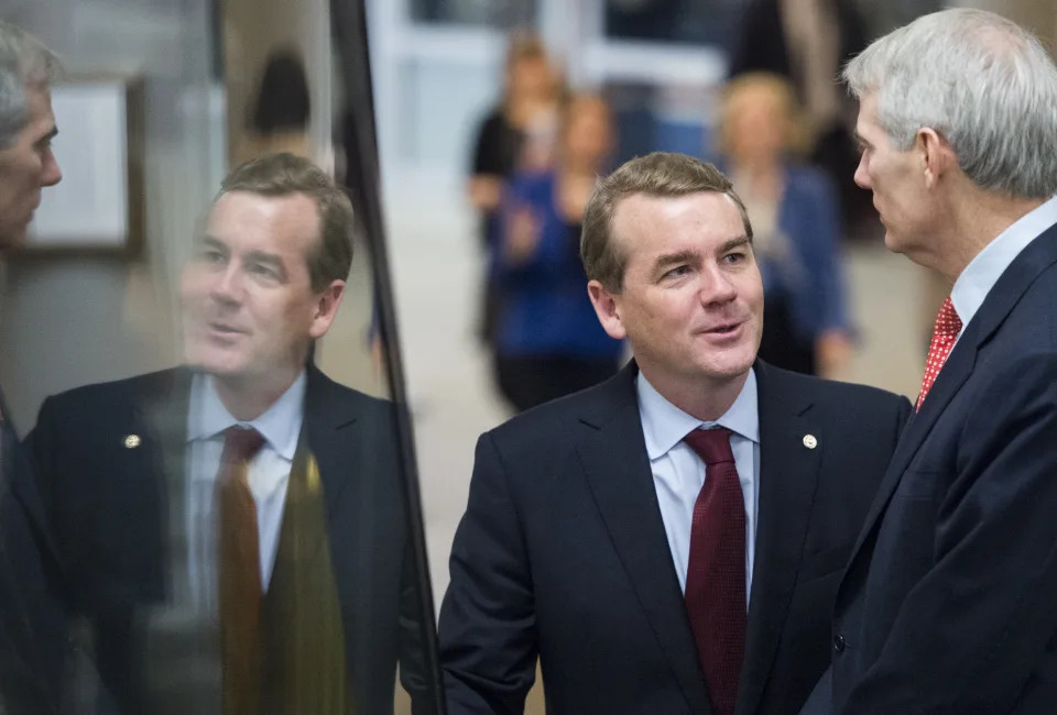 UNITED STATES - DECEMBER 4: Sen. Michael Bennet, D-Colo., and Sen. Rob Portman, R-Ohio, talk as they arrive in the Capitol on Thursday, Dec. 4, 2014. (Photo By Bill Clark/CQ Roll Call)