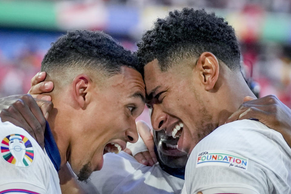England's Jude Bellingham, right, and England's Trent Alexander-Arnold celebrate after a quarterfinal match between England and Switzerland at the Euro 2024 soccer tournament in Duesseldorf, Germany, Saturday, July 6, 2024. (AP Photo/Darko Vojinovic)