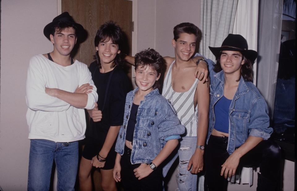 With his Menudo friends.