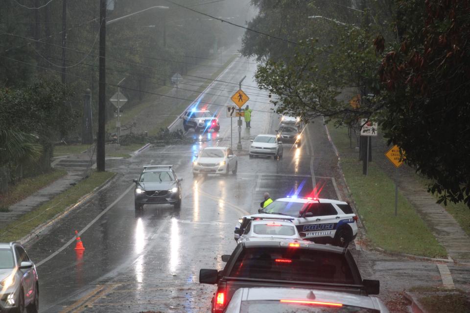 Police deal with damage caused by a storm in Gainesville.