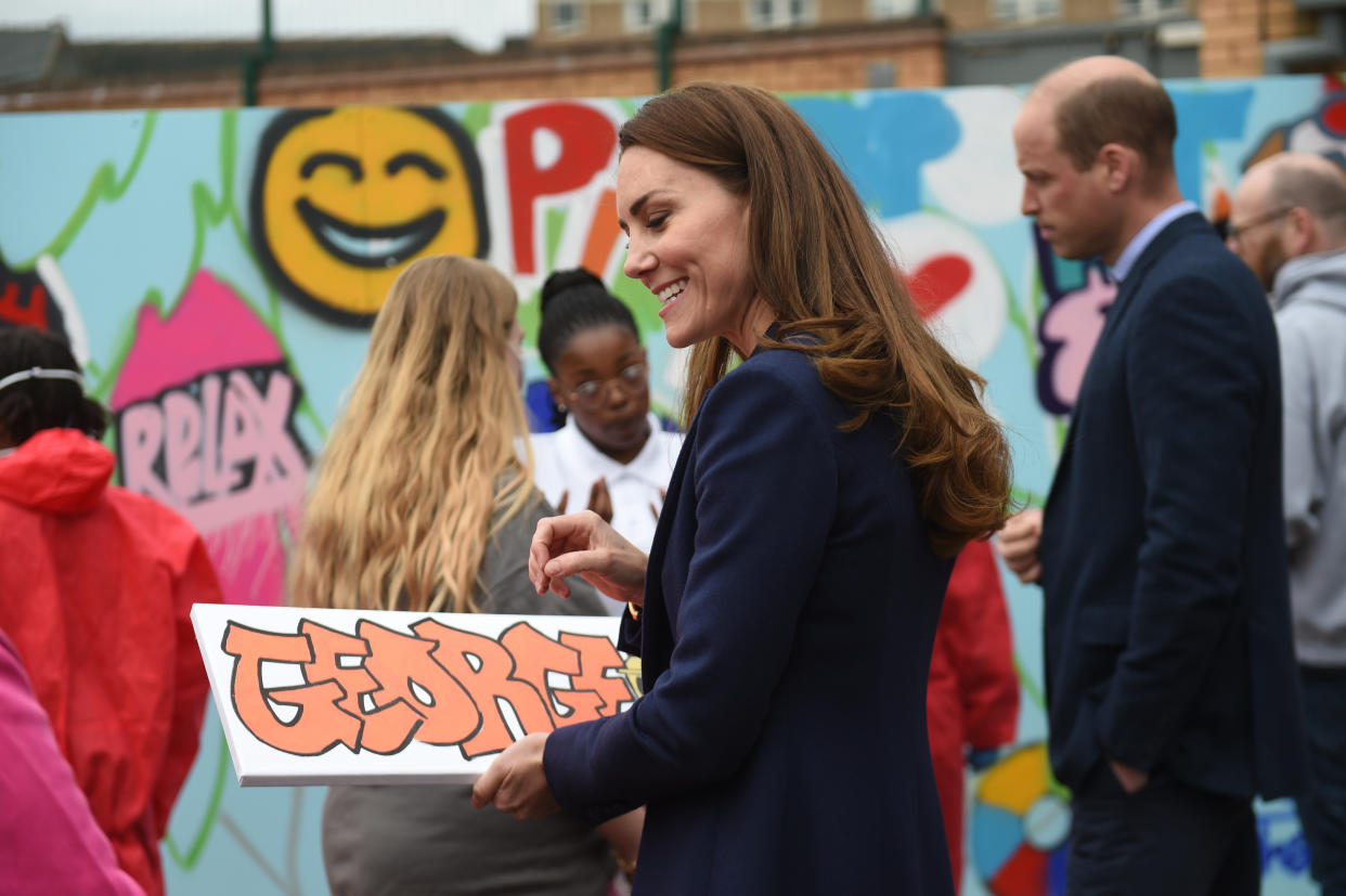 The Duchess of Cambridge is presented with a gift for Prince George during a visit to The Way Youth Zone in Wolverhampton, West Midlands. Picture date: Thursday May 13, 2021.