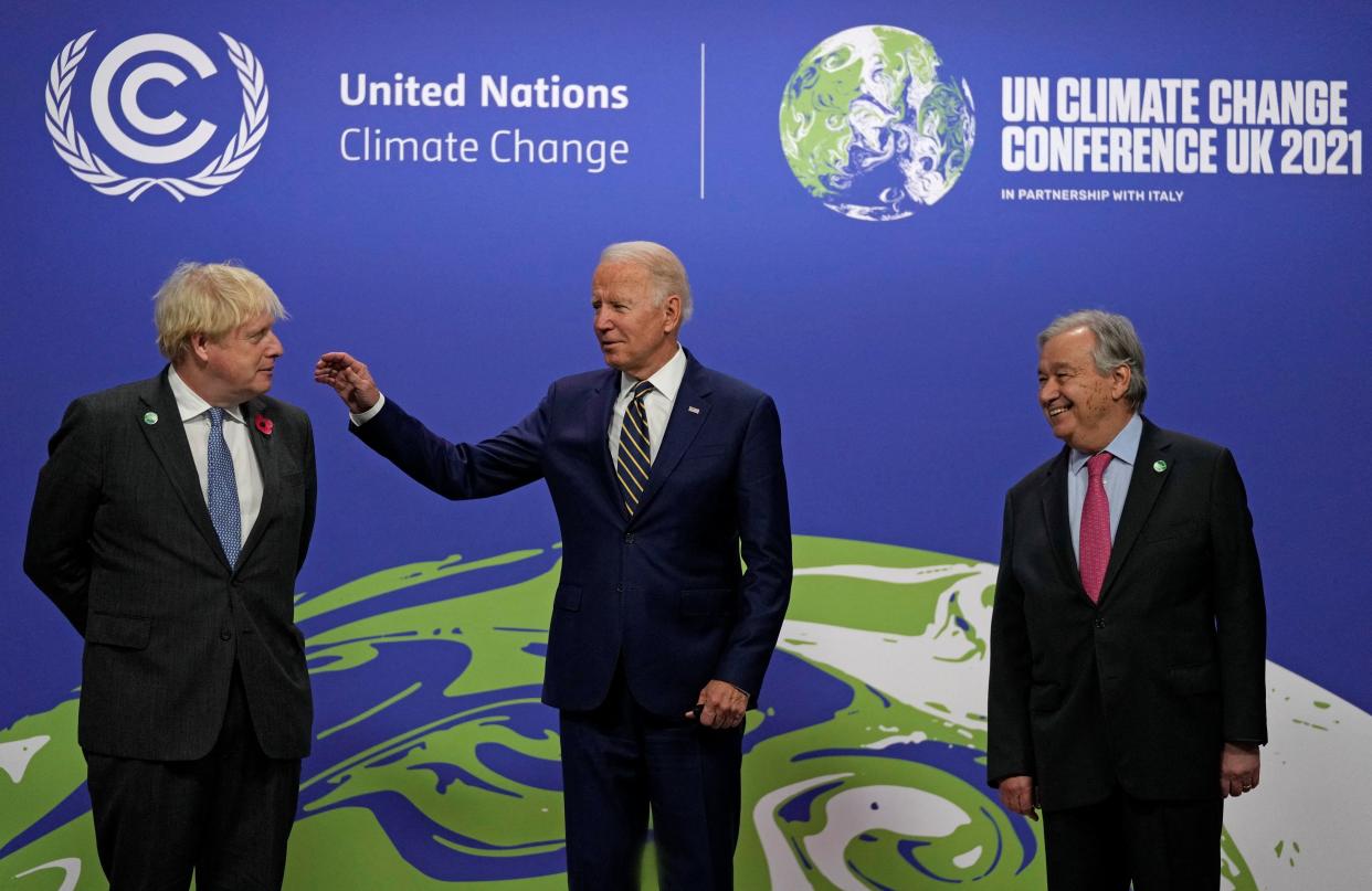 British Prime Minister Boris Johnson, left, and U.N. Secretary-General António Guterres, right, with President Biden at the U.N. Climate Change Conference in Glasgow, Scotland