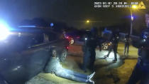 The image from video released on Jan. 27, 2023, by the City of Memphis, shows Tyre Nichols leaning against a car after a brutal attack by five Memphis police officers on Jan. 7, 2023, in Memphis, Tenn. Nichols died on Jan. 10. The five officers have since been fired and charged with second-degree murder and other offenses. (City of Memphis via AP)