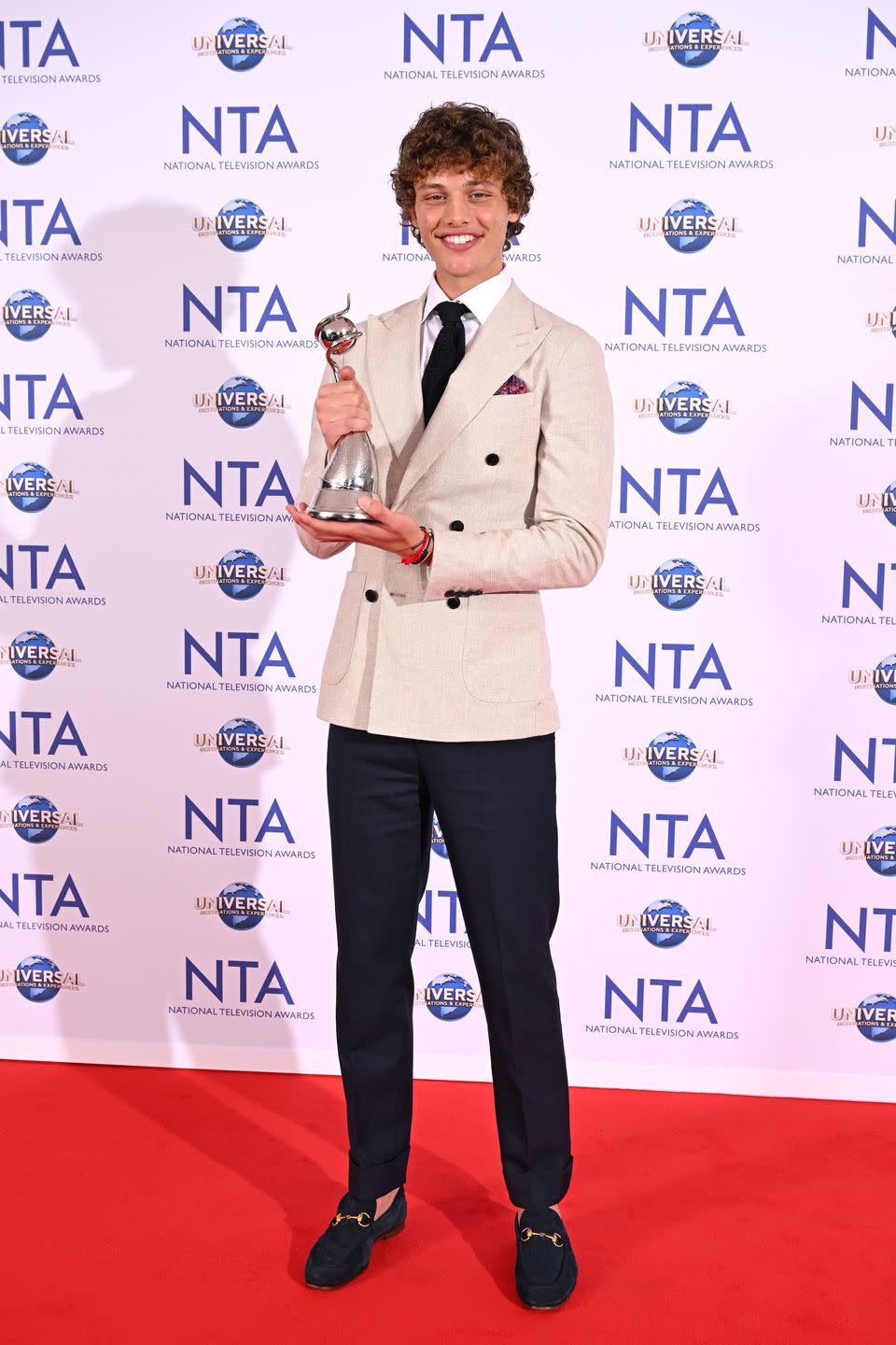 bobby brazier holding national television award and smiling