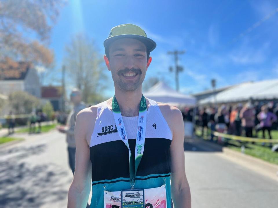 A smiling Joe Stewart, first-time marathon runner, took first place at the Fredericton race.