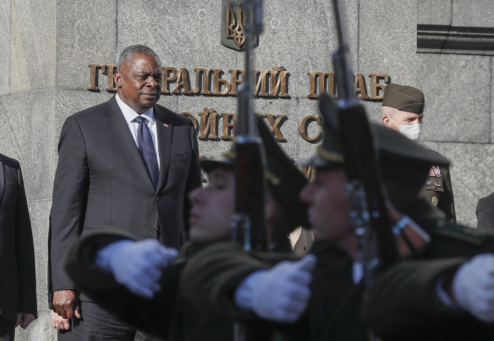 U.S. Defense Secretary Lloyd Austin reviews the honor guard during a welcome ceremony in Kyiv, Ukraine, Tuesday, Oct. 19, 2021. (Gleb Garanich/Pool Photo via AP)