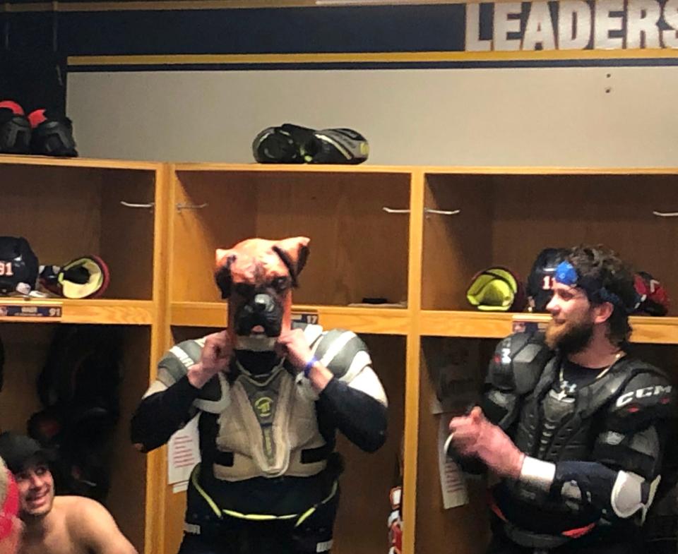 Peoria Rivermen captain Alec Hagaman pulls on the team's ceremonial dog mask while teammates look on after a 5-2 victory in Game 2 of the SPHL semifinals eliminated Evansville and sent the Rivermen to the President's Cup Final on Friday, April 19, 2024.
