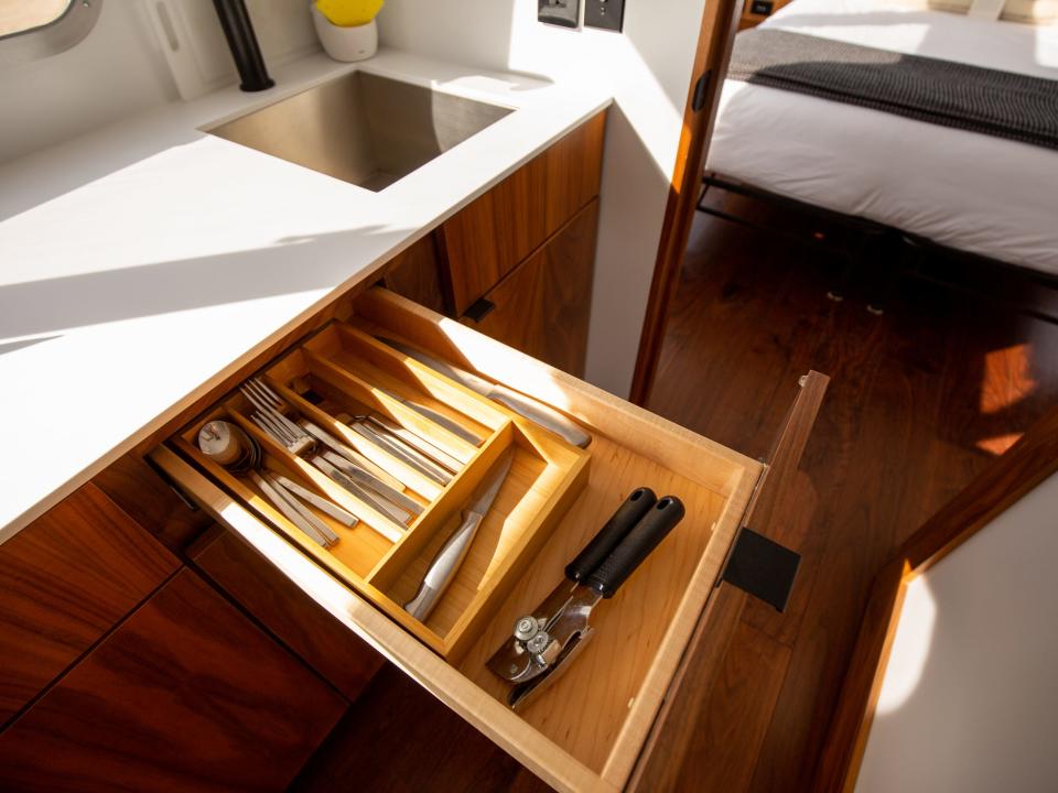 Autocamp Joshua Tree's Airsteram trailer with an open drawer showing cutlery.