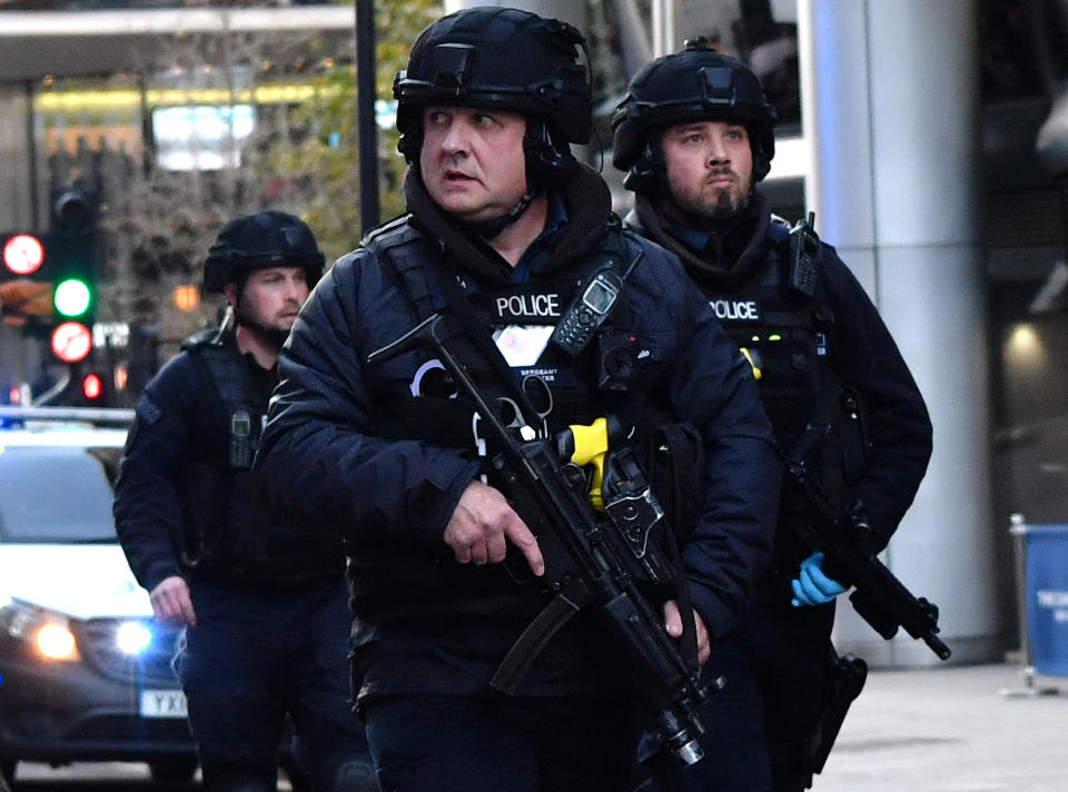 Armed police patrol along Cannon Street in central London, on November 29, 2019 after reports of shots being fired on London Bridge. - The Metropolitan Police on Friday said several people were injured and a man was held after a stabbing near London Bridge in the centre of the British capital. (Photo by Ben STANSALL / AFP) (Photo by BEN STANSALL/AFP via Getty Images)