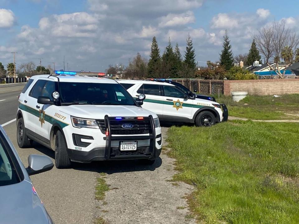 Fresno County Sheriff’s Offfice vehicles can be seen near the location of a reported shooting in Selma, California, on Tuesday, Jan. 31, 2023.