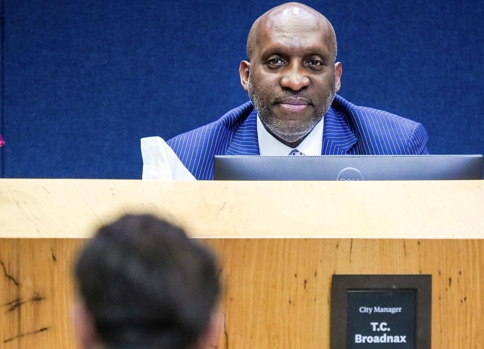 New Austin City Manager T.C. Broadnax listens to Chris Gannon, AIA Austin Housing Advocacy Committee co-chair, during Thursday's City Council meeting.