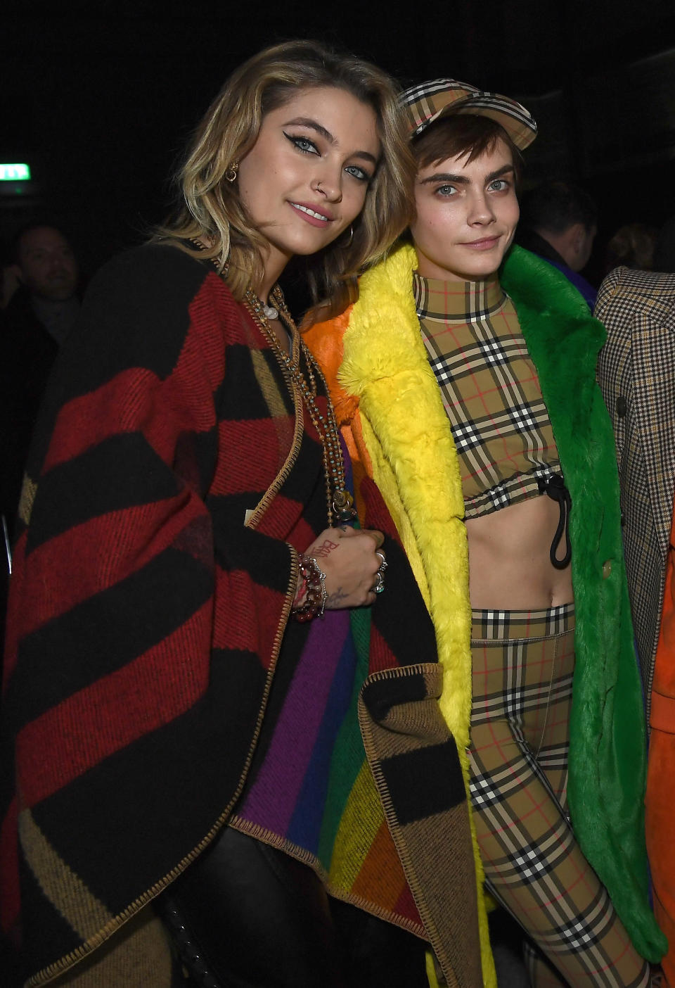 Paris Jackson and Cara Delevingne at the Burberry February 2018 show during London Fashion Week. (Photo: Gareth Cattermole/Getty Images for Burberry)