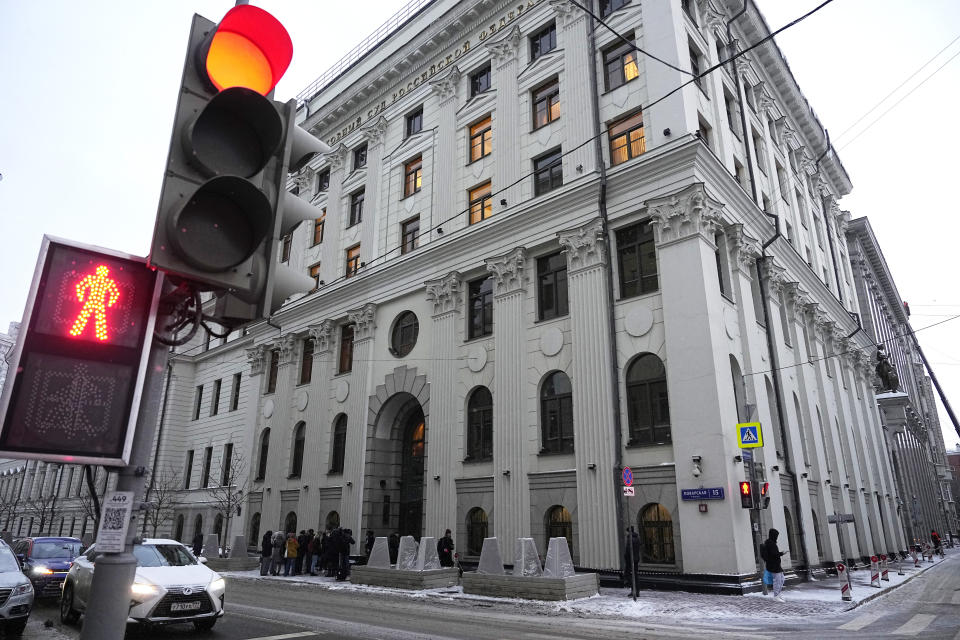 Cars wait on a traffic light in front of the Russian Supreme Court in Moscow, Russia, Thursday, Nov. 30, 2023. Russia's Supreme Court on Thursday effectively outlawed LGBTQ+ activism, the most drastic step against advocates of gay, lesbian and transgender rights in the increasingly conservative country. The court sided with the Justice Ministry, which filed a lawsuit this month demanding an LGBTQ+ "movement" in Russia to be labeled extremist. Rights activists argue the move opens the way for a broad crackdown on any individuals or groups deemed to be part of this movement. (AP Photo/Alexander Zemlianichenko)