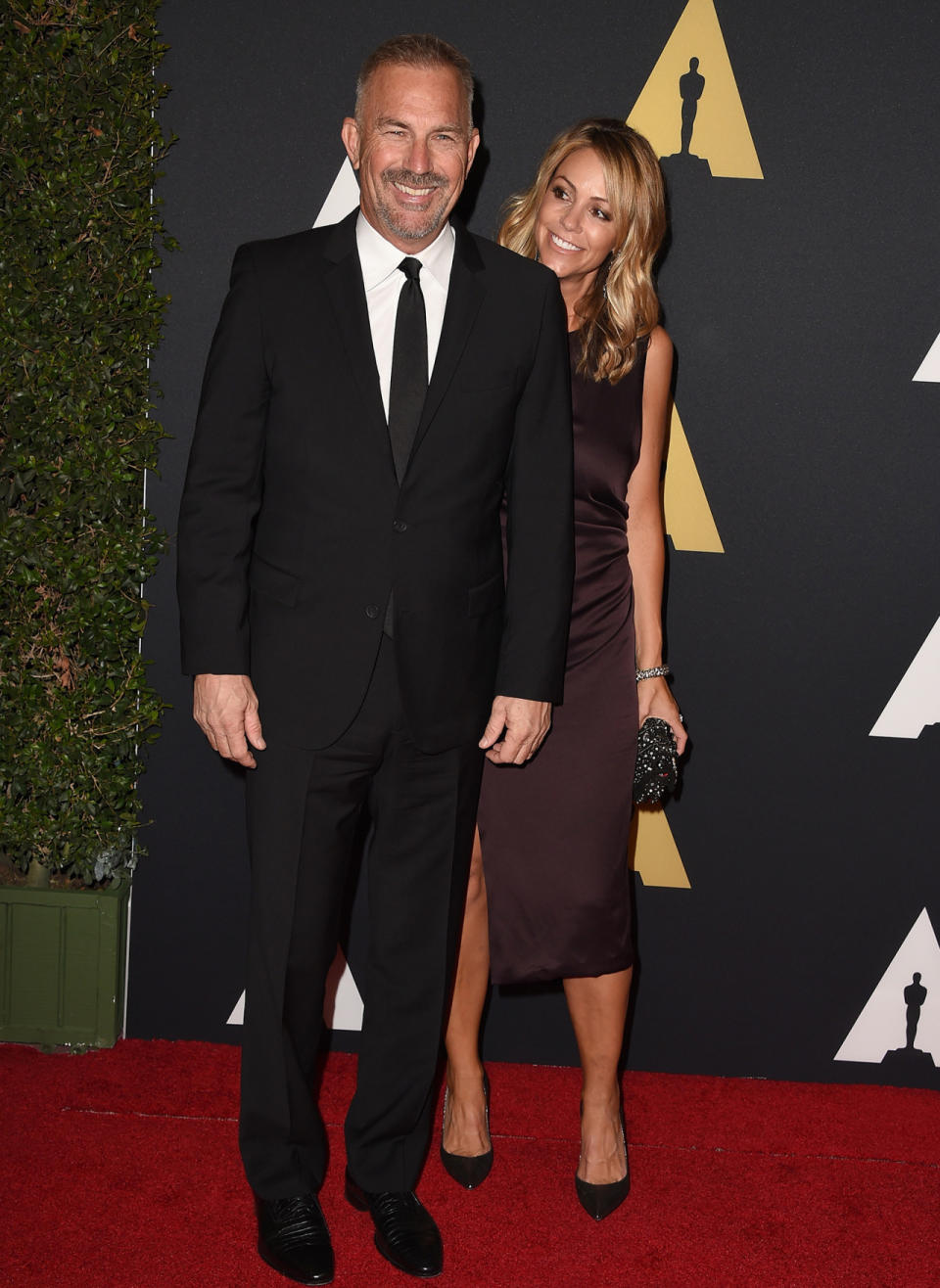 HOLLYWOOD, CA - NOVEMBER 08: Actor Kevin Costner (L) and model Christine Baumgartner attend the Academy Of Motion Picture Arts And Sciences’ 2014 Governors Awards at The Ray Dolby Ballroom at Hollywood & Highland Center on November 8, 2014 in Hollywood, California.