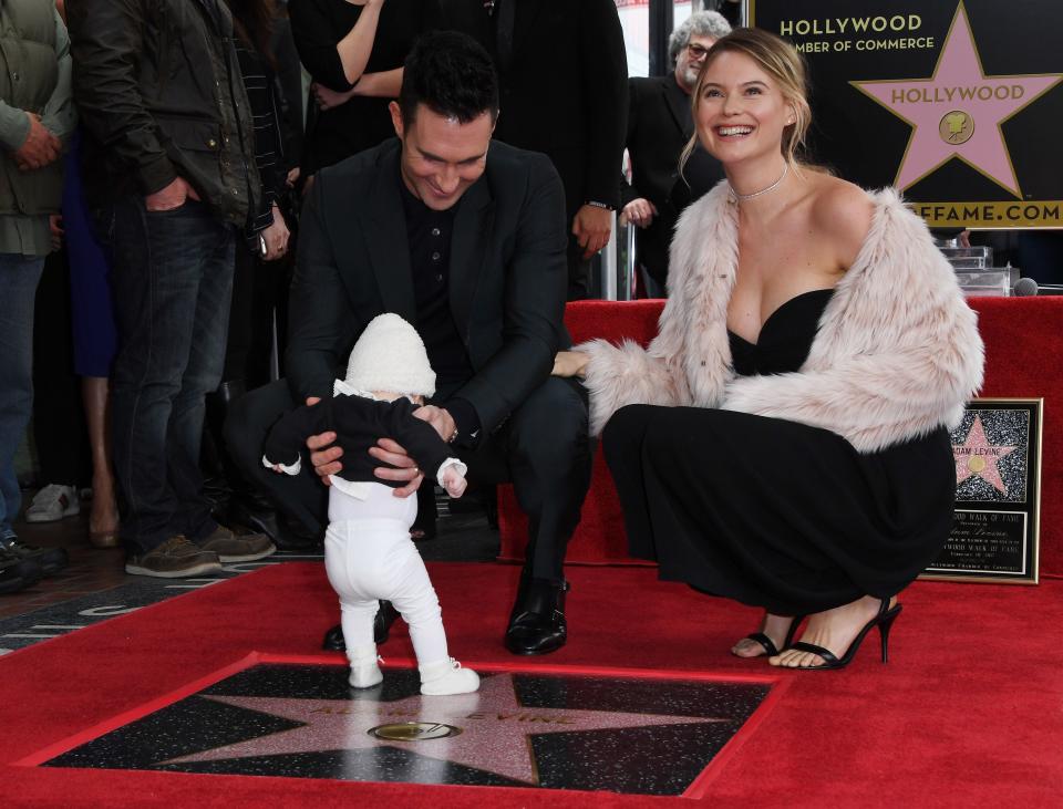 Adam Levine, left, with his wife, Behati Prinsloo and daughter, Dusty Rose, after he was honored with a star on the Hollywood Walk of Fame in 2017.