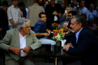 Chilean presidential candidate Alejandro Guillier meets with Uruguayan former president Jose Mujica as part of a campaign rally in Santiago, Chile December 14, 2017. REUTERS/Ivan Alvarado