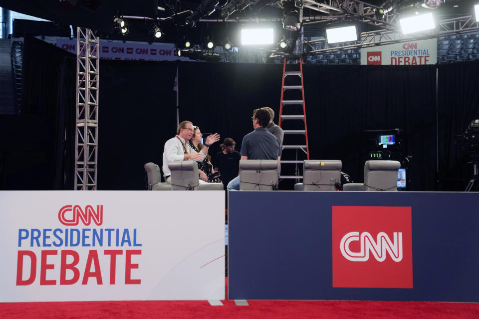 People converse during setup in the spin room for the upcoming CNN Presidential Debate between President Joe Biden and Republican presidential candidate former President Donald Trump in Atlanta, Wednesday, June 26, 2024. (AP Photo/Gerald Herbert)