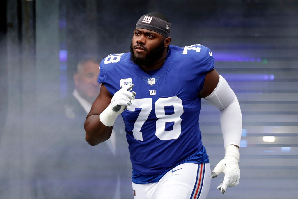 New York Giants offensive tackle Andrew Thomas (78) takes the field before an NFL football game against the Baltimore Ravens, Sunday, Oct. 16, 2022, in East Rutherford, N.J. (AP Photo/Adam Hunger, File)