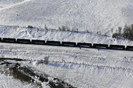 A train makes its way along the Burlington Northern Santa Fe (BNSF) rail line outside of Williston, North Dakota March 12, 2013. REUTERS/Shannon Stapleton