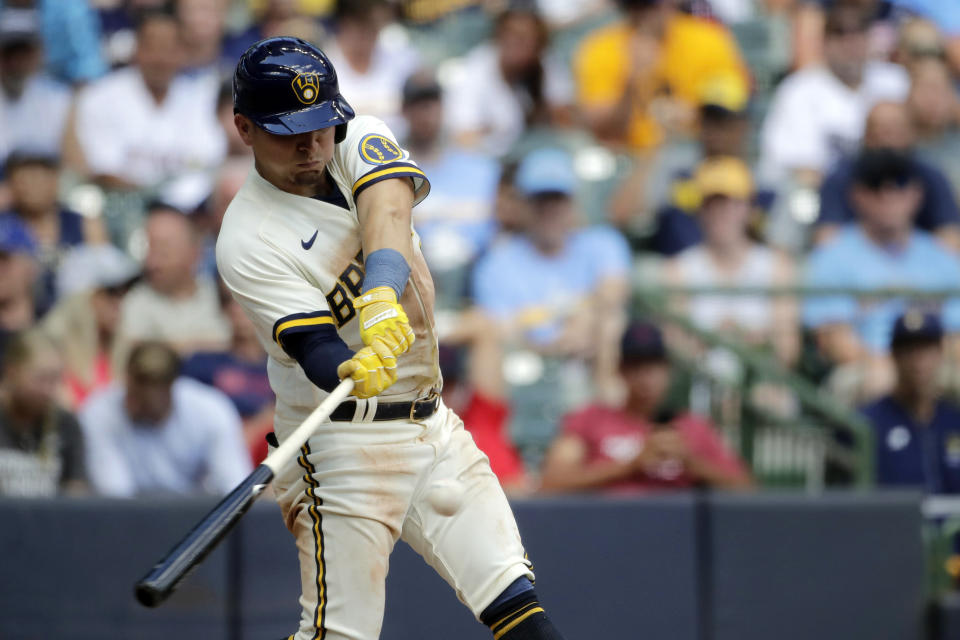 Milwaukee Brewers' Luis Urias hits a two-run home run during the fifth inning of a baseball game against the Minnesota Twins, Wednesday, July 27, 2022, in Milwaukee. (AP Photo/Aaron Gash)