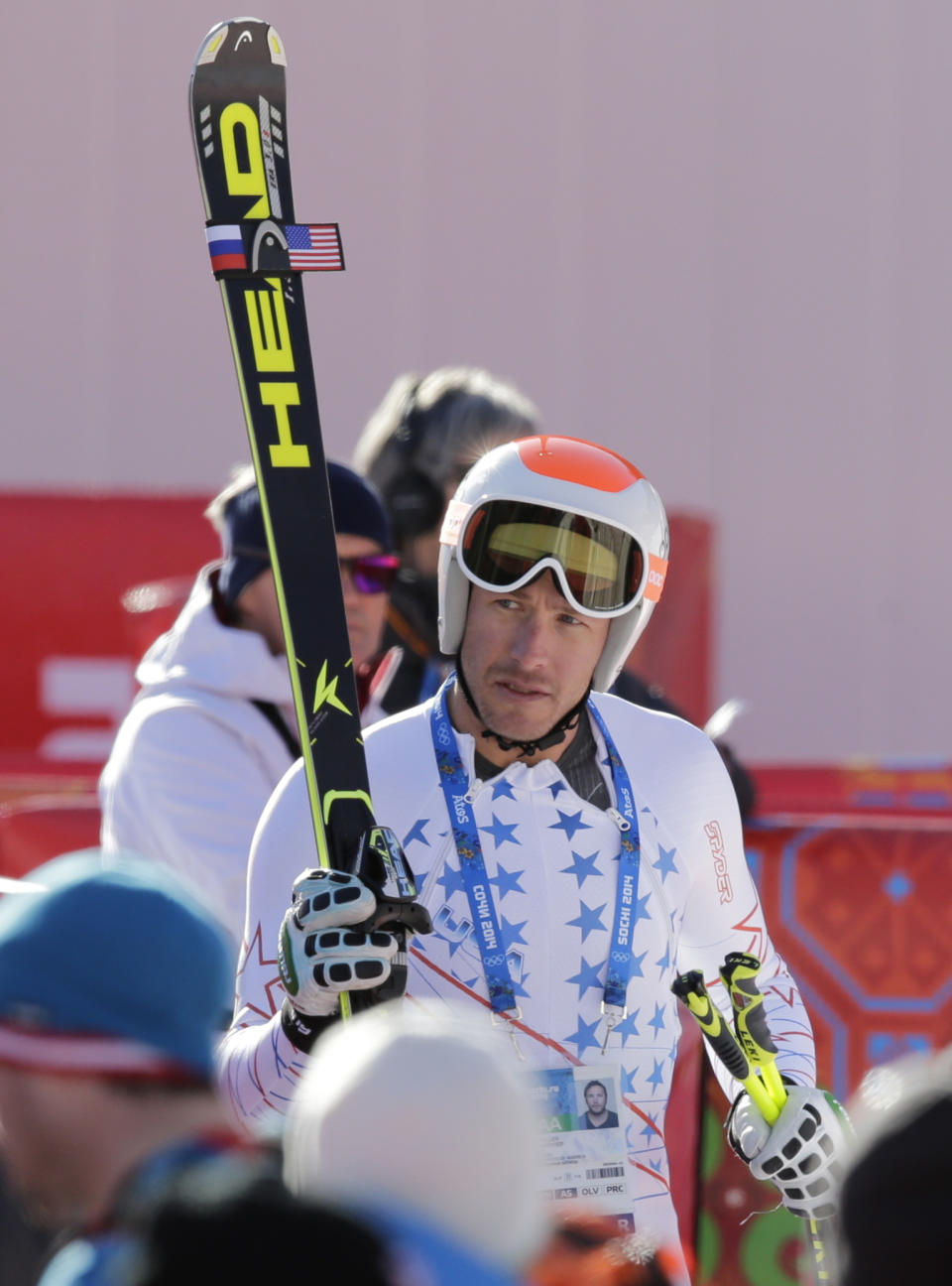 United States' Bode Miller carries his skis in the finish area after a men's downhill training run for the Sochi 2014 Winter Olympics, Friday, Feb. 7, 2014, in Krasnaya Polyana, Russia. (AP Photo/Gero Breloer)