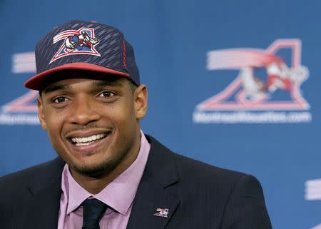 Newly signed defensive end Michael Sam smiles as he is introduced to the media by the Montreal Alouettes CFL football team in Montreal, in this file photo taken May 26, 2015. REUTERS/Christinne Muschi/Files