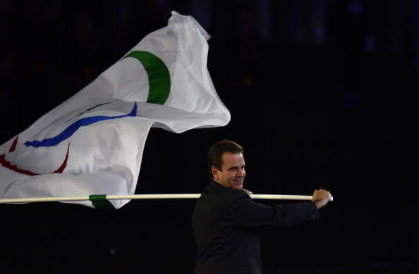 Mayor of Rio de Janeiro Eduardo Paes waves the Paralympic flag after the handover ceremony during the closing ceremony of the London 2012 Paralympic Games at the Olympic Stadium in east London on September 9, 2012. AFP PHOTO / ADRIAN DENNIS (Photo credit should read ADRIAN DENNIS/AFP/GettyImages)