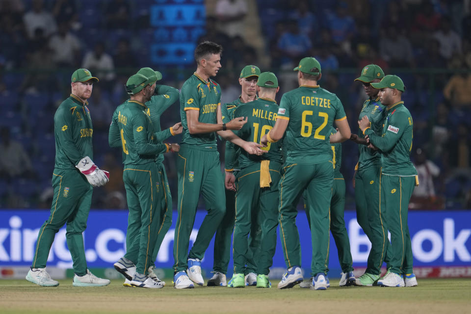 South Africa's Marco Jansen, without cap, celebrates with teammates the dismissal of Sri Lanka's Kusal Perera during the ICC Cricket World Cup match between South Africa and Sri Lanka in New Delhi, India, Saturday, Oct. 7, 2023. (AP Photo/Altaf Qadri )