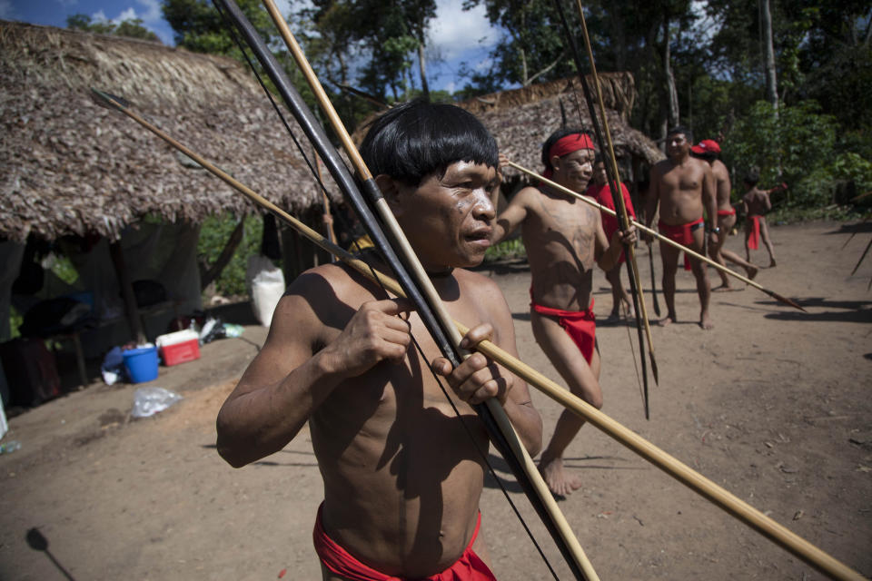 Yanomami Indians dance in their village called Irotatheri in Venezuela's Amazon region.