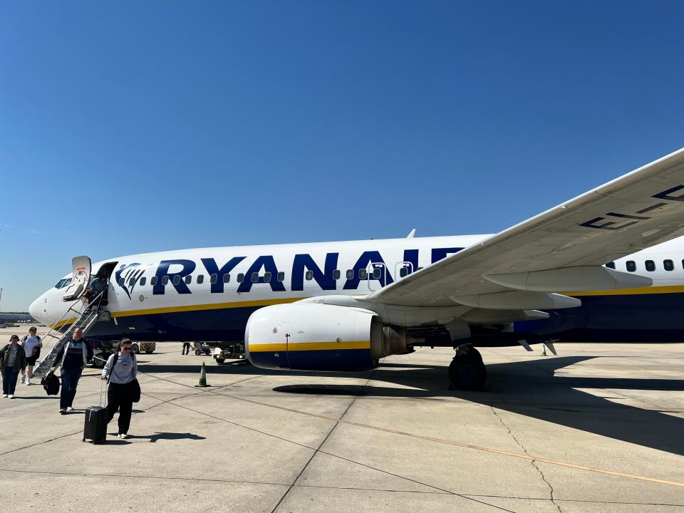 Passengers deplane a Ryanair Boeing 737-800 at Madrid Airport on April 15, 2024