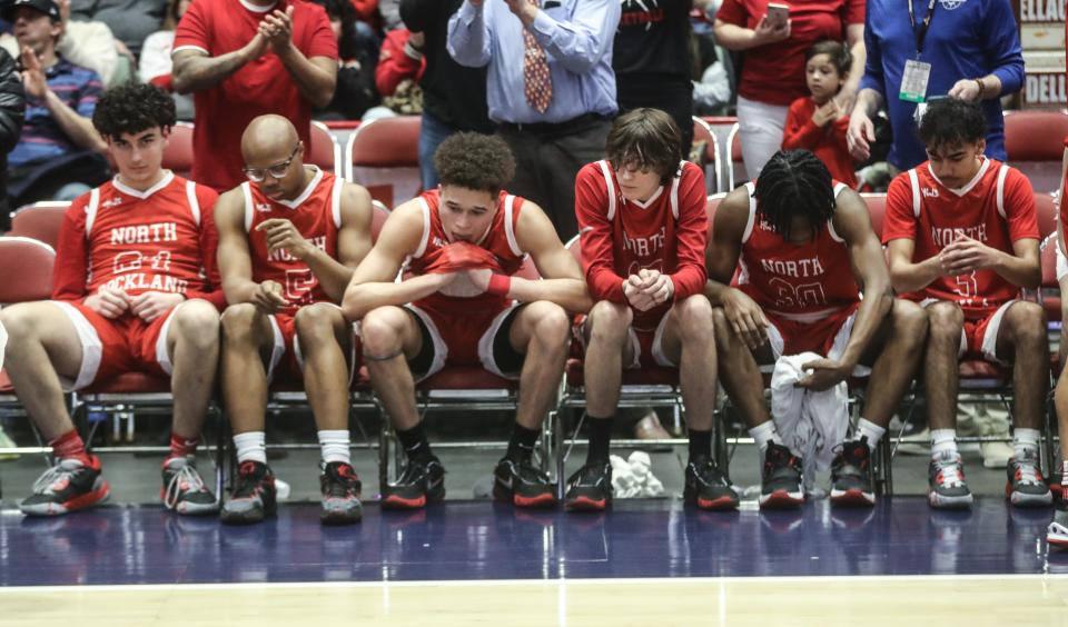 North Rockland players sit on the bench after falling to Victor 56-38 in the NYSPHSAA Class AA basketball championship game at the Cool Insuring Arena in Glens Falls March 17, 2023.