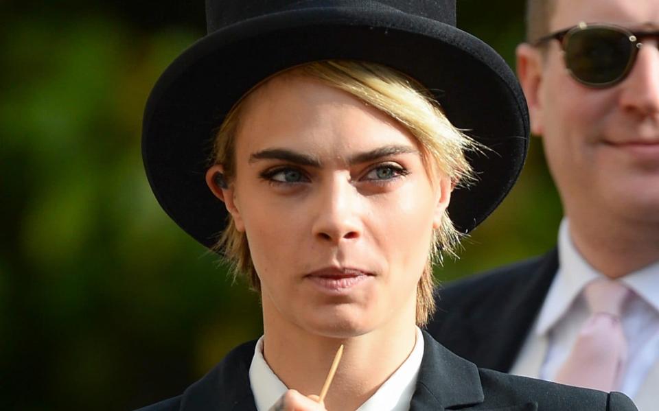 Cara Delevingne attended the wedding of Princess Eugenie of York and Jack Brooksbank in top hat and tails -  Pool/Samir Hussein/WireImage