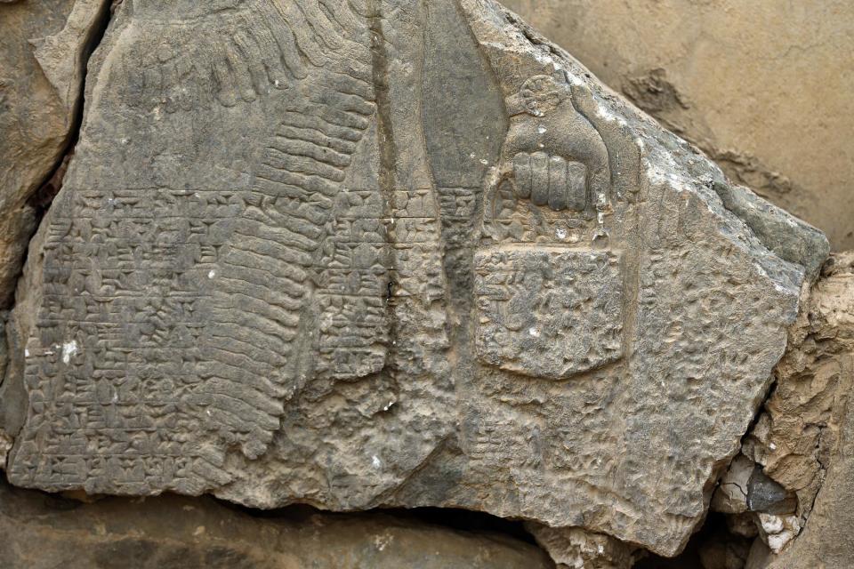 FILE - This Wednesday, Nov. 16, 2016 file photo shows a part of carved stone slabs which were destroyed by Islamic State group militants, at the ancient site of Nimrud some 19 miles (30 kilometers) southeast of Mosul, Iraq. One of the Mideast’s most important archaeological sites, the nearly 3,000-year-old remains of an Assyrian capital had been a trove of ancient Mesopotamian art and, with hundreds of clay tablets, provided archaeologists a wealth of information on the era. (AP Photo/Hussein Malla, File)