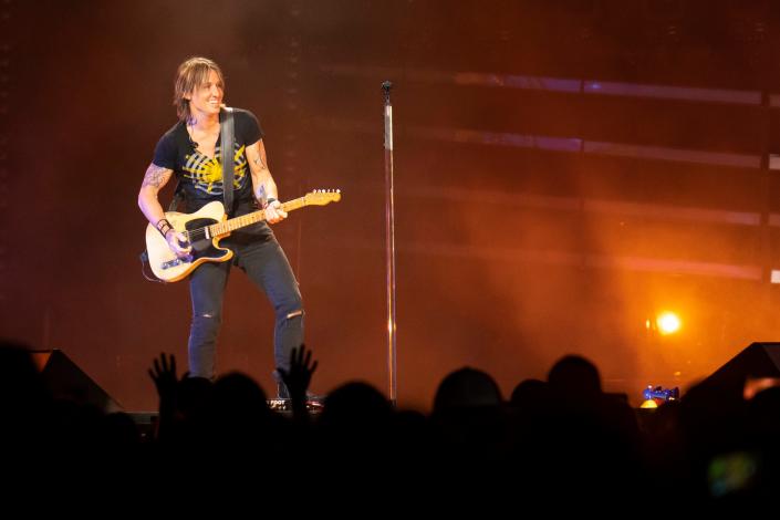 Keith Urban smiles while performing during a concert in September at Nationwide Arena.