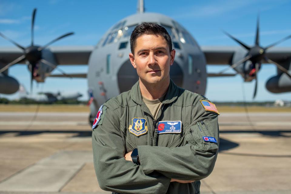lt col jeremy dehart, 53rd weather reconnaissance squadron aerial reconnaissance weather officer, stands in front of a wc 130j super hercules aircraft at keesler air force base, oct 18, 2022 the 53rd wrs supports weather data collection efforts around the year us air force photo by staff sgt kristen pittman