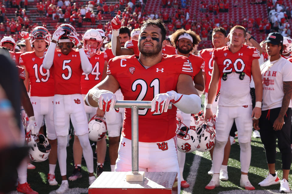 Sep 23, 2023; Salt Lake City, Utah, USA; Utah Utes linebacker <a class="link " href="https://sports.yahoo.com/ncaaf/players/322403" data-i13n="sec:content-canvas;subsec:anchor_text;elm:context_link" data-ylk="slk:Karene Reid;sec:content-canvas;subsec:anchor_text;elm:context_link;itc:0">Karene Reid</a> (21) lights the U after a win against the UCLA Bruins at Rice-Eccles Stadium. Mandatory Credit: Rob Gray-USA TODAY Sports