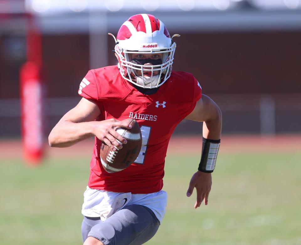 Red Hook's Landon Ramsey (4) rolls out of the pocket during football action against O'Neill at Red Hook High School in Red Hook on Saturday, September 24, 2022.