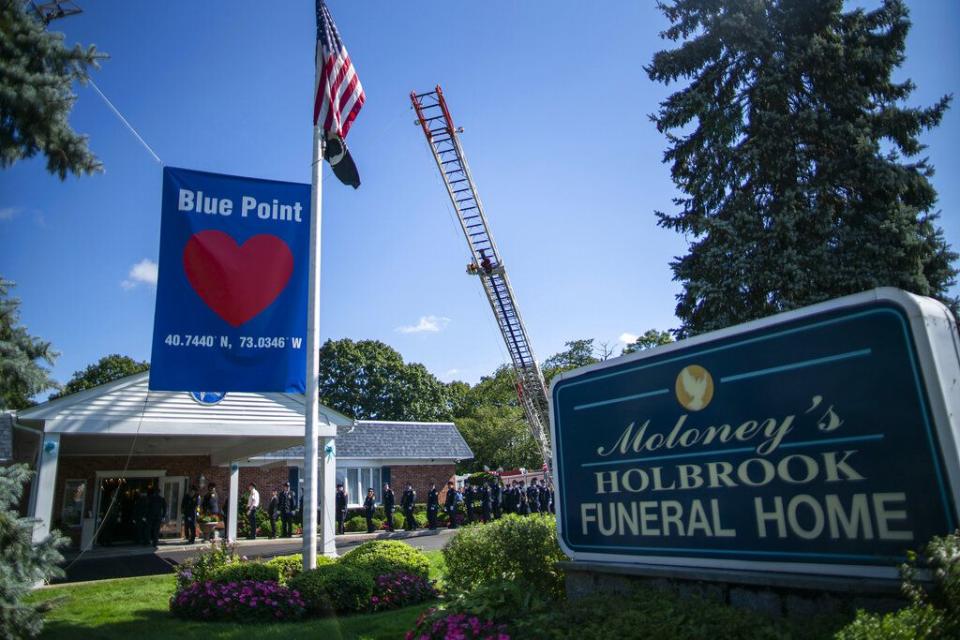 Long Island firefighters attend the funeral home viewing of Gabby Petito at Moloney's Holbrook Funeral Home in Holbrook, N.Y. Sunday, Sept. 26, 2021. (AP Photo/Eduardo Munoz Alvarez)