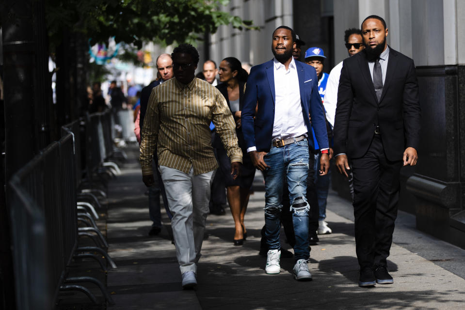 Rapper Meek Mill departs from the criminal justice center in Philadelphia after a status hearing, Tuesday, Aug. 6, 2019. A decision on whether Mill will be retried in a drug and gun case has been delayed until later this month. (AP Photo/Matt Rourke)