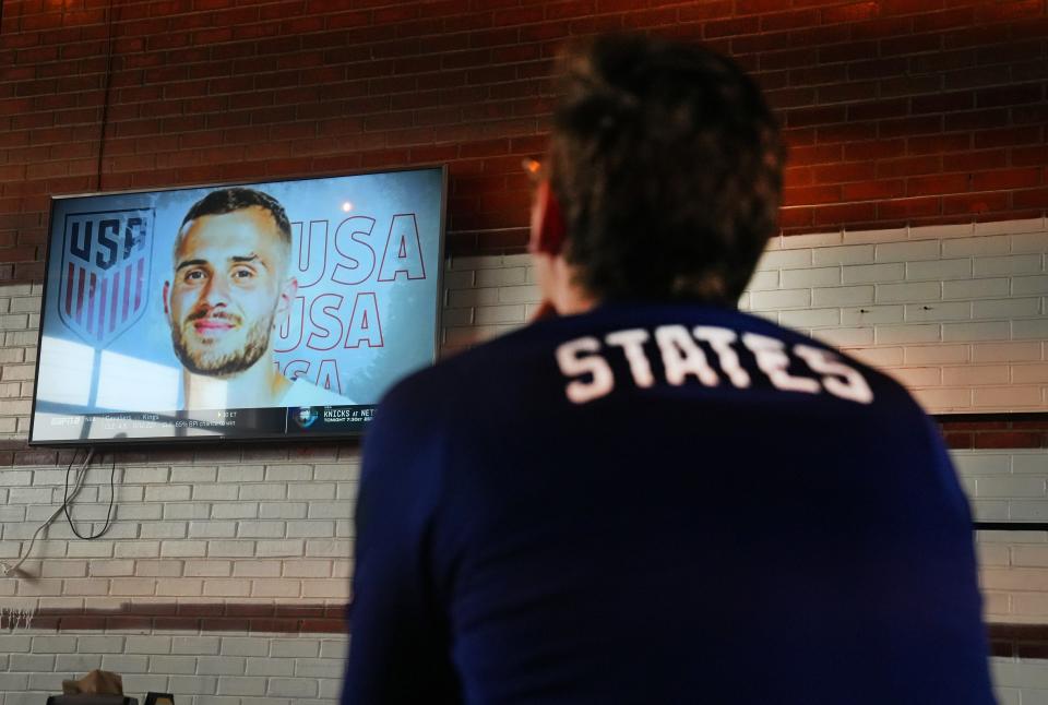 Nov 9, 2022; Phoenix, Ariz., U.S.;  U.S. Supporter Ben Federspiel, listens to the announcement of the USMNT World Cup roster during a watch party at Walter Station Brewery in Phoenix, Mandatory Credit: Cheryl Evans-Arizona Republic
