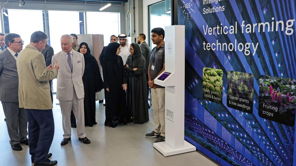 King Charles III watches a demonstration about vertical farming technology during a visit at the Heriot-Watt University 