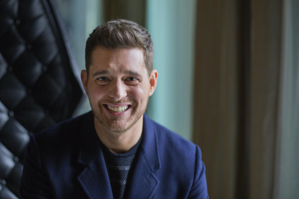 FILE - In this Oct. 18, 2016 file photo,Canadian singer Michael Buble poses for a photo to promote the upcoming Oct. 21 release of his new album "Nobody But Me" in Toronto. The Canadian singer is not retiring from music despite reports circulating online. In an interview with The Associated Press, Buble disputed a report in the Daily Mail that said he was quit after the release of his upcoming album “Love,” due out Nov. 16. The report suggested that the Grammy-winning singer was stepping away from music for good following his son Noah’s cancer battle. Buble responded to the report saying, "I'll keep going until the news of my death comes out, which will probably be fake too." (Michelle Siu/The Canadian Press via AP, File)