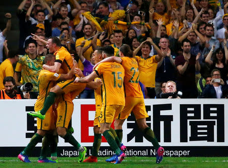 Football Soccer - Australia vs United Arab Emirates - 2018 World Cup Qualifying Asian Zone - Group B - Sydney Football Stadium, Sydney, Australia - 28/3/17 - Australia's players celebrate with teammate Mathew Leckie (7) after Leckie scored a goal against UAE. REUTERS/David Gray