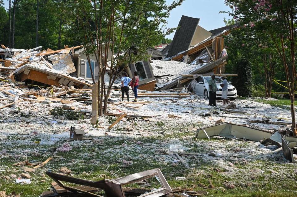 The remains of a $3 million home on Lake Norman collapsed in Mooresville, N.C., at about 12 a.m. on Tuesday, Aug. 22, 2023. Mooresville firefighters found one person dead in the 25-foot pile of rubble.