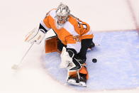 Philadelphia Flyers goaltender Carter Hart (79) fails to stop the puck on a shot from New York Islanders defenseman Andy Greene during first-period NHL Stanley Cup Eastern Conference playoff hockey game action in Toronto, Monday, Aug. 24, 2020. (Frank Gunn/The Canadian Press via AP)